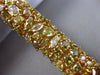 ESTATE WIDE 25.30CT WHITE FANCY NATURAL YELLOW DIAMOND 18K GOLD TENNIS BRACELET