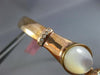 ESTATE .10CT DIAMOND & AAA MOON STONE 14KT ROSE GOLD TWO STONE BANGLE BRACELET