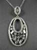 ESTATE .64CT ROUND & BAGUETTE DIAMOND 14KT WHITE GOLD 3D OPEN FILIGREE PENDANT