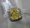 ESTATE 2.26CTW GIA FANCY YELLOW DIAMOND 18KT WHITE GOLD HALO ENGAGEMENT RING