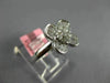 ESTATE .71CT DIAMOND 18KT WHITE GOLD ROUND & BAGUETTE 4 LEAF CLOVER FLOWER RING