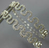 ESTATE WIDE .62CT DIAMOND 18KT WHITE GOLD 3D MULTI WAVE HANGING HOOP EARRINGS