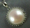 ESTATE .25CT DIAMOND & AAA PEARL 14KT WHITE GOLD 3D CLASSIC ROUND HALO PENDANT