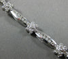 ESTATE WIDE 2.66CT DIAMOND 14KT WHITE GOLD ROUND FLOWER CHANNEL TENNIS BRACELET