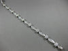 ESTATE WIDE 2.66CT DIAMOND 14KT WHITE GOLD ROUND FLOWER CHANNEL TENNIS BRACELET