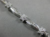 ESTATE WIDE 2.66CT DIAMOND 14KT WHITE GOLD ROUND FLOWER CHANNEL TENNIS BRACELET
