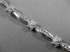 ESTATE WIDE 2.66CT DIAMOND 14KT WHITE GOLD ROUND FLOWER CHANNEL TENNIS BRACELET