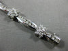 ESTATE WIDE 2.66CT DIAMOND 14KT WHITE GOLD ROUND FLOWER CHANNEL TENNIS BRACELET