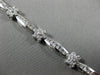 ESTATE WIDE 2.66CT DIAMOND 14KT WHITE GOLD ROUND FLOWER CHANNEL TENNIS BRACELET