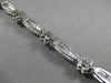 ESTATE WIDE 2.66CT DIAMOND 14KT WHITE GOLD ROUND FLOWER CHANNEL TENNIS BRACELET