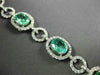 ESTATE WIDE 9.57CT DIAMOND & AAA EMERALD 18KT WHITE GOLD 3D HALO TENNIS BRACELET