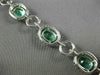 ESTATE WIDE 9.57CT DIAMOND & AAA EMERALD 18KT WHITE GOLD 3D HALO TENNIS BRACELET