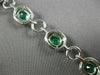 ESTATE WIDE 9.57CT DIAMOND & AAA EMERALD 18KT WHITE GOLD 3D HALO TENNIS BRACELET
