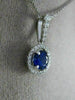 ESTATE .80CT DIAMOND & SAPPHIRE 18KT WHITE GOLD CLASSIC ROUND FLOATING PENDANT