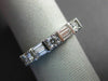 ESTATE .45CT DIAMOND 18KT WHITE GOLD 3D ROUND & BAGUETTE 3MM ANNIVERSARY RING