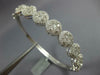ESTATE WIDE 3.48CT DIAMOND 18KT WHITE GOLD 3D MULTI FLOWER HALO BANGLE BRACELET