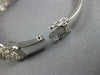 ESTATE WIDE 3.48CT DIAMOND 18KT WHITE GOLD 3D MULTI FLOWER HALO BANGLE BRACELET