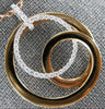 ESTATE LARGE .34CT DIAMOND 18KT WHITE & ROSE GOLD CIRCULAR LOVE KNOT FUN PENDANT