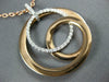 ESTATE LARGE .34CT DIAMOND 18KT WHITE & ROSE GOLD CIRCULAR LOVE KNOT FUN PENDANT