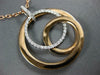 ESTATE LARGE .34CT DIAMOND 18KT WHITE & ROSE GOLD CIRCULAR LOVE KNOT FUN PENDANT