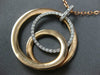 ESTATE LARGE .34CT DIAMOND 18KT WHITE & ROSE GOLD CIRCULAR LOVE KNOT FUN PENDANT