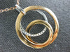 ESTATE LARGE .34CT DIAMOND 18KT WHITE & ROSE GOLD CIRCULAR LOVE KNOT FUN PENDANT