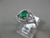 ESTATE WIDE .81CT DIAMOND & AAA EMERALD 14KT WHITE GOLD INFINITY ENGAGEMENT RING