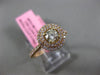 ESTATE .71CT WHITE & FANCY YELLOW DIAMOND 18KT YELLOW GOLD HALO ENGAGEMENT RING