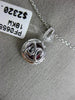 ESTATE .94CT ROUND DIAMOND & AAA RUBY 18KT WHITE GOLD CIRCULAR FLOATING PENDANT