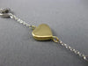 ESTATE LONG TIFFANY & CO. 18K WHITE & YELLOW GOLD FLOATING HEART BRACELET #23095
