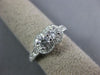 ESTATE .80CT DIAMOND 14KT WHITE GOLD TWO STONE SEMI ETERNITY FILIGREE LOVE RING