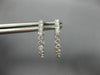 ESTATE .55CT DIAMOND 18KT WHITE GOLD 3D CLASSIC ROUND 2MM OVAL HUGGIE EARRINGS