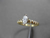 ESTATE .56CT ROUND & MARQUISE DIAMOND 14KT YELLOW GOLD ENGAGEMENT RING #16107