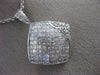 1.82CT ROUND & PRINCESS DIAMOND 18KT WHITE GOLD INVISIBLE SQUARE FLOWER PENDANT