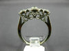 ESTATE WIDE .61CT DIAMOND 14KT WHITE GOLD 3 STONE HALO PAST PRESENT FUTURE RING