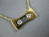 ESTATE .11CT DIAMOND 18KT 2 TONE GOLD 3D 2 STONE ETOILE FLOATING LOVE PENDANT