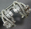 ESTATE .93CT DIAMOND 18KT WHITE GOLD ROUND & BAGUETTE INFINITY CLIP ON EARRINGS