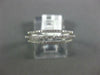 ESTATE .20CT DIAMOND 18KT WHITE GOLD CLASSIC OPEN THREE ROW FUN RING