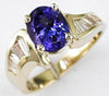 3.05CT DIAMOND & AAA TANZANITE 14KT YELLOW GOLD OVAL & BAGUETTE ANNIVERSARY RING