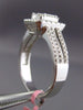 ESTATE LARGE .66CT ROUND & BAGUETTE DIAMOND 18KT WHITE GOLD HALO ENGAGEMENT RING