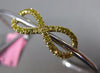 ESTATE .73CT WHITE & FANCY YELLOW DIAMOND 18KT 2 TONE GOLD INFINITY LOVE BANGLE