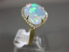 ESTATE EXTRA LARGE 8.13CT DIAMOND & AAA OPAL 14KT YELLOW GOLD CLASSIC HALO RING