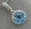 ESTATE .63CT DIAMOND & AAA BLUE TOPAZ 14KT WHITE GOLD CLASSIC HALO ROUND PENDANT