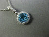 ESTATE .63CT DIAMOND & AAA BLUE TOPAZ 14KT WHITE GOLD CLASSIC HALO ROUND PENDANT