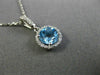 ESTATE .63CT DIAMOND & AAA BLUE TOPAZ 14KT WHITE GOLD CLASSIC HALO ROUND PENDANT
