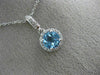 ESTATE .63CT DIAMOND & AAA BLUE TOPAZ 14KT WHITE GOLD CLASSIC HALO ROUND PENDANT