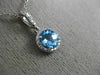 ESTATE .63CT DIAMOND & AAA BLUE TOPAZ 14KT WHITE GOLD CLASSIC HALO ROUND PENDANT