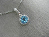ESTATE .63CT DIAMOND & AAA BLUE TOPAZ 14KT WHITE GOLD CLASSIC HALO ROUND PENDANT