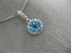 ESTATE .63CT DIAMOND & AAA BLUE TOPAZ 14KT WHITE GOLD CLASSIC HALO ROUND PENDANT