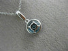 ESTATE .63CT DIAMOND & AAA BLUE TOPAZ 14KT WHITE GOLD CLASSIC HALO ROUND PENDANT